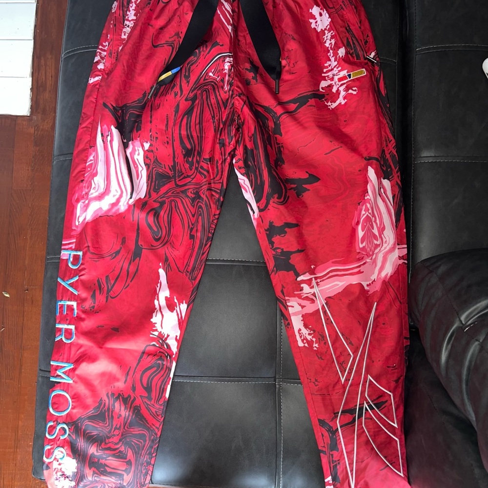 Red wind breaker pants by Pyer Moss in collaboration with brand new with tags